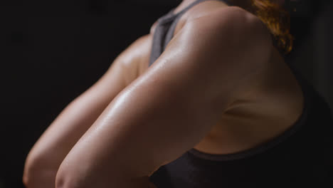 Close-Up-Studio-Shot-Showing-Mature-Woman-Wearing-Gym-Fitness-Clothing-Doing-Stretching-Exercises-2